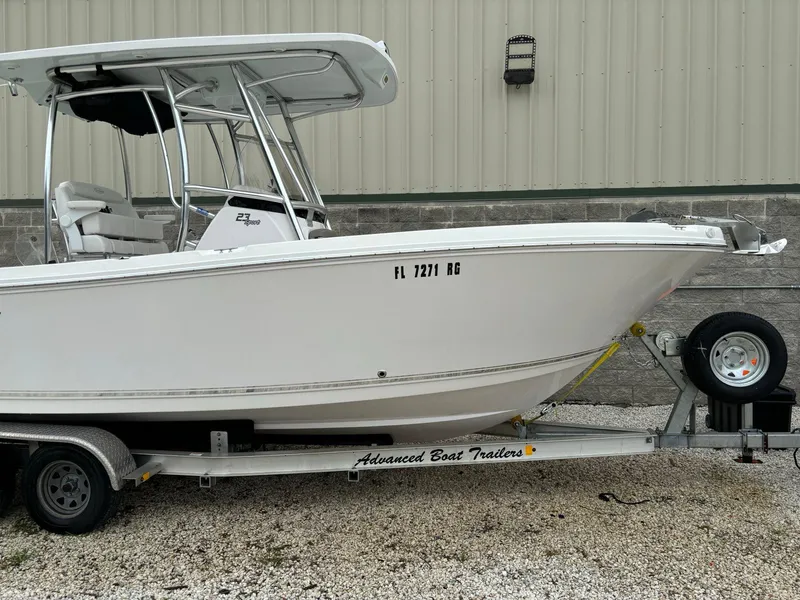 Slide: The Image of 2017 Pro-Line 23 Sport boat on trailer, parked outdoors. - 1