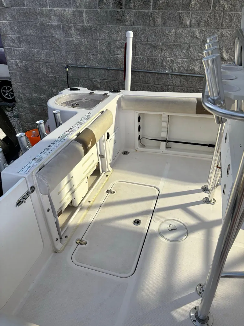 Slide: The Image of 2017 Pro-Line 23 Sport boat interior with seating and storage compartments. - 19
