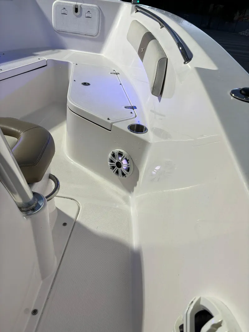 Slide: The Image of 2017 Pro-Line 23 Sport boat interior with seating and speaker. - 22