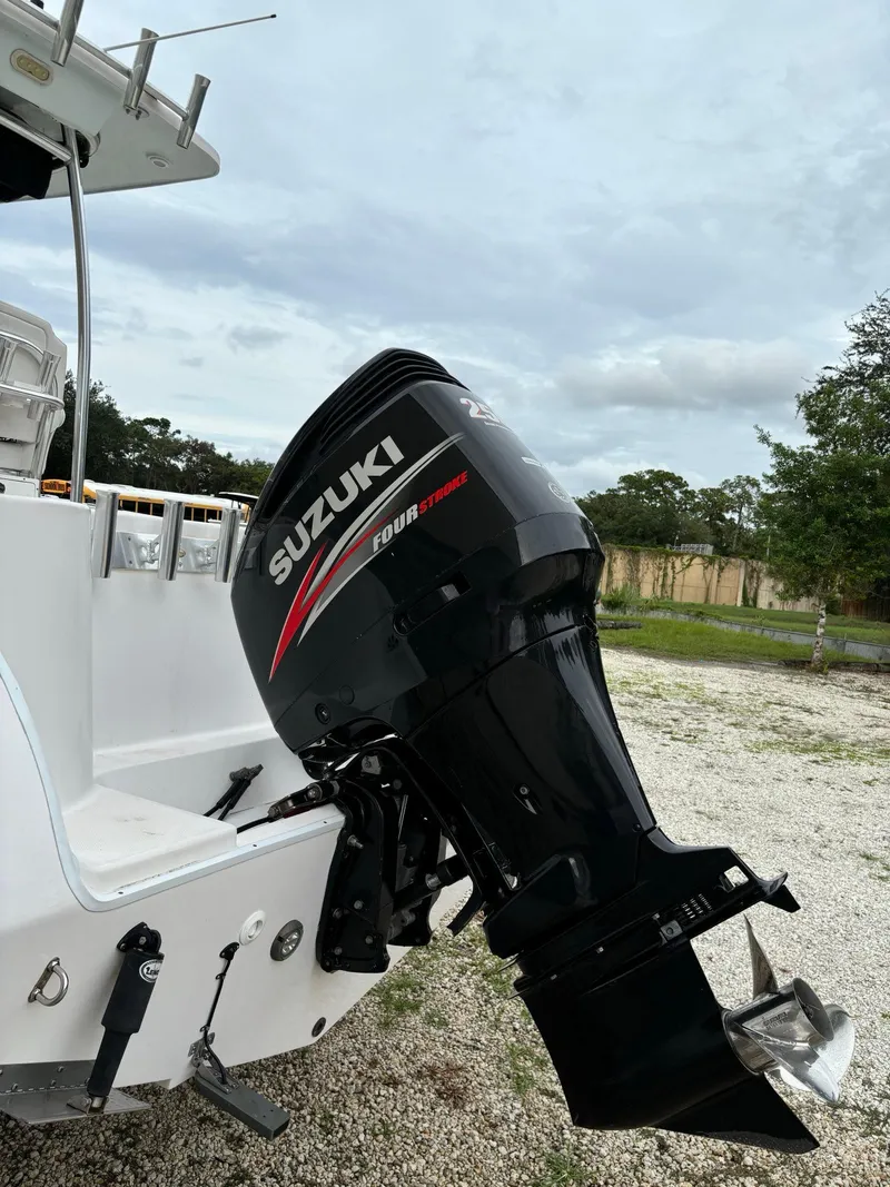 Slide: The Image of 2017 Pro-Line 23 Sport boat with Suzuki outboard motor. - 29