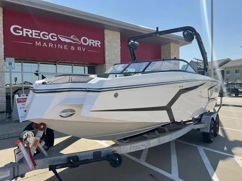 Slide: The Image of 2023 Heyday WTSurf boat on trailer at Gregg Orr Marine & RV dealership. - 1
