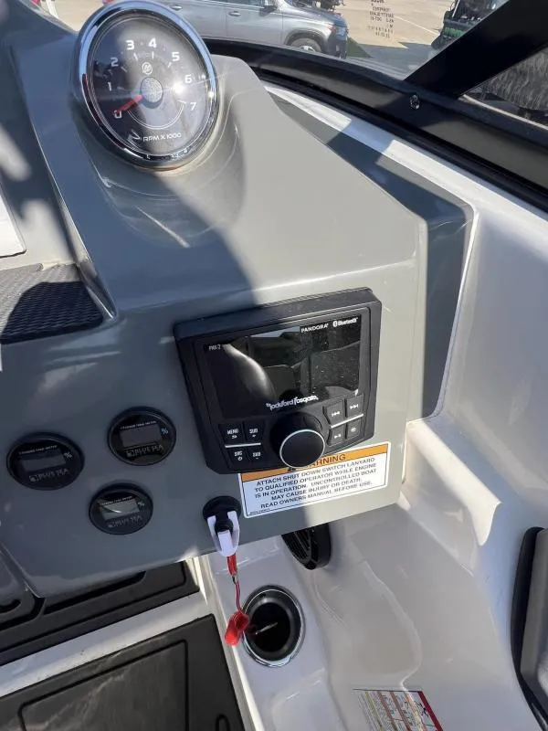 Slide: The Image of 2023 Heyday WTSurf boat dashboard with tachometer and Rockford Fosgate stereo system. - 11