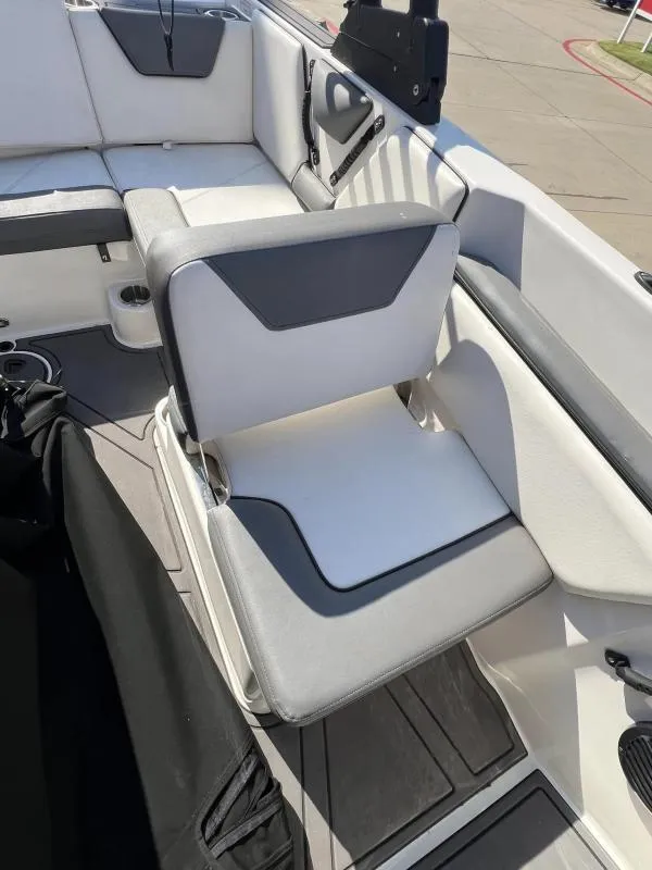 Slide: The Image of 2023 Heyday WTSurf boat interior with white and gray seating. - 14