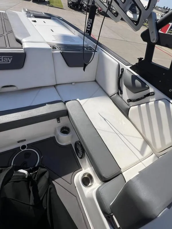 Slide: The Image of 2023 Heyday WTSurf boat interior with gray and white seating. - 15