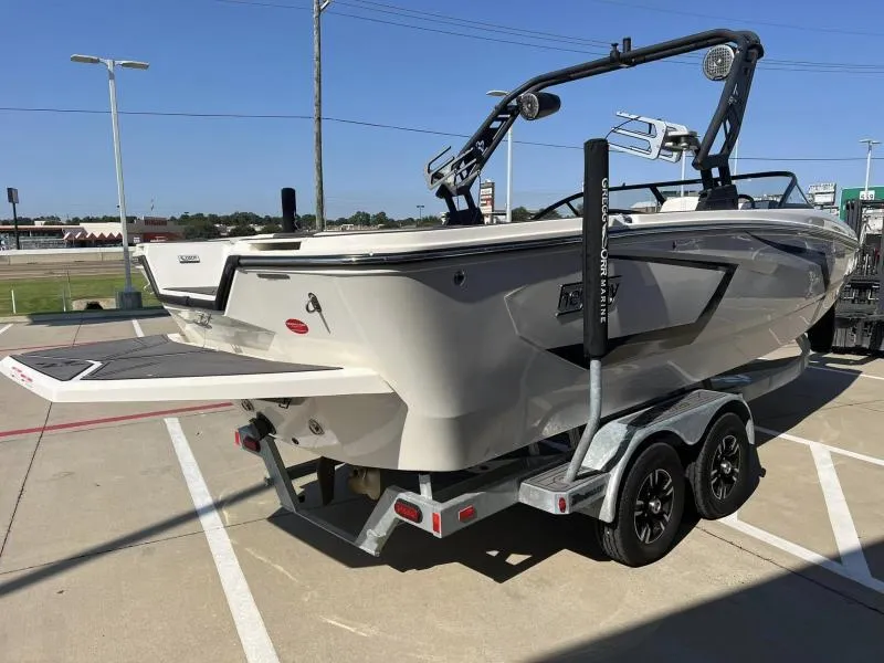 Slide: The Image of 2023 Heyday WTSurf boat on trailer in parking lot, side view. - 4