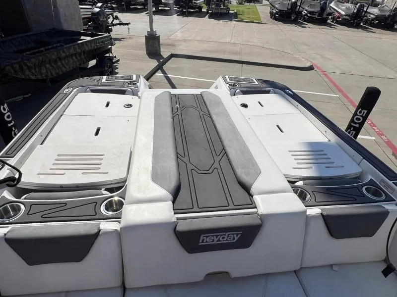 Slide: The Image of 2023 Heyday WTSurf boat deck with sleek design and cup holders. - 8