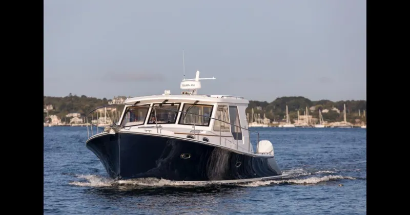 The Image of 2025 True North 39 Outboard Express boat on water with cruise ships in background. - 0