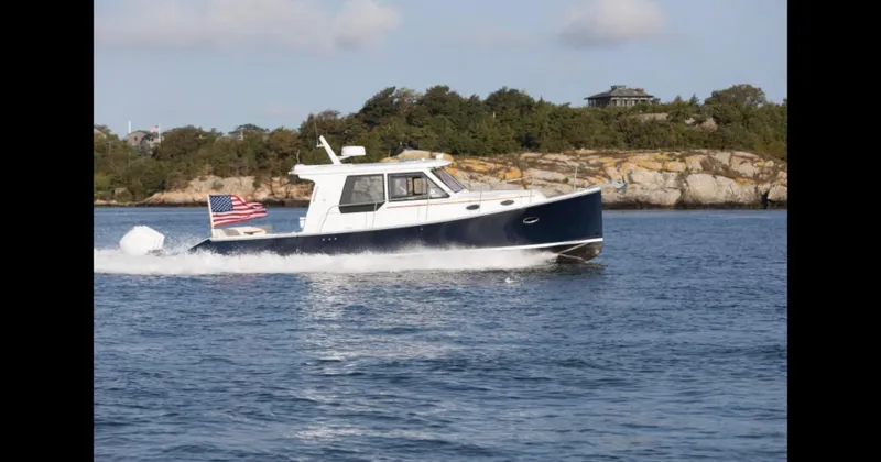 Slide: The Image of 2025 True North 39 Outboard Express boat interior with modern navigation system. - 11