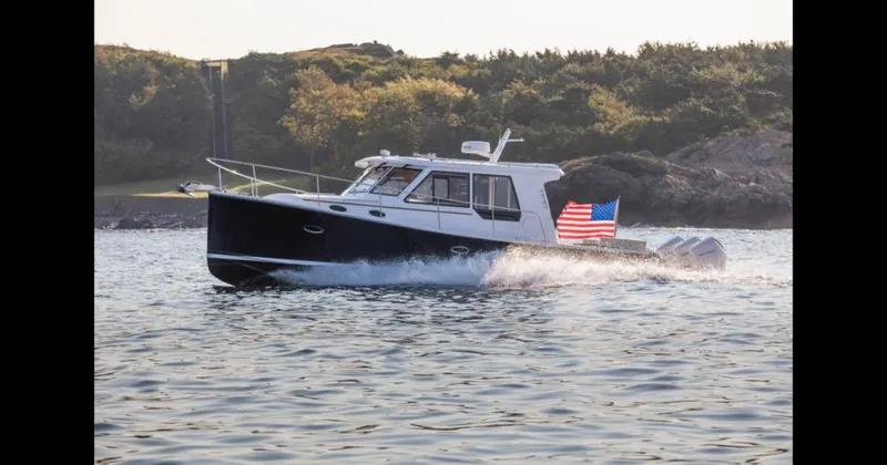 Slide: The Image of 2025 True North 39 Outboard Express cruising on open water. - 9