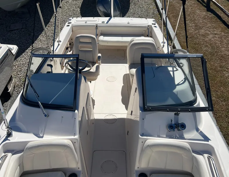 Slide: The Image of 2015 Grady-White 225 Freedom boat interior with seating and open windshield. - 4