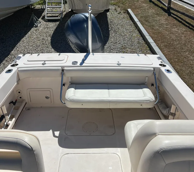 Slide: The Image of 2015 Grady-White 225 Freedom boat interior with seating and storage compartments. - 5