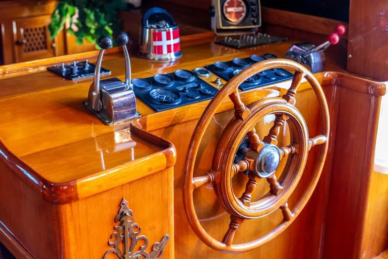 Slide: The Image of Wooden helm of 1984 Marine Trader Aft Cabin Motor Yacht with classic controls. - 19