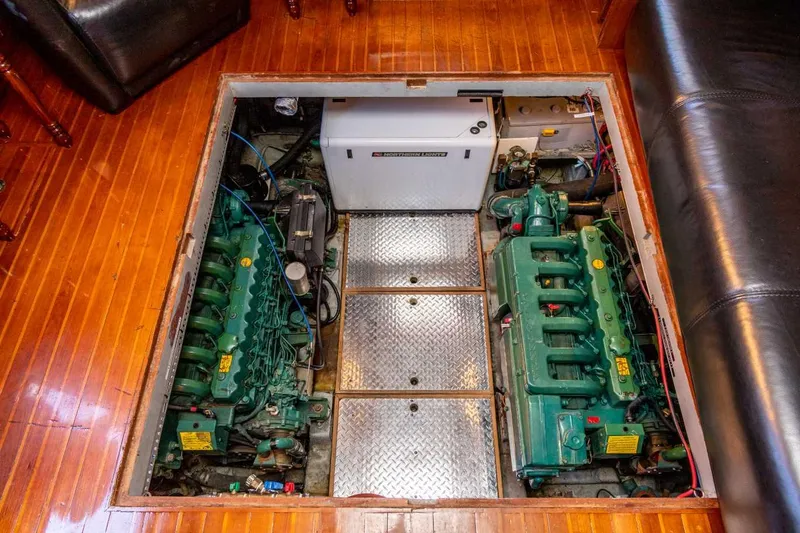 Slide: The Image of Engine room of 1984 Marine Trader Aft Cabin Motor Yacht with twin green engines. - 26