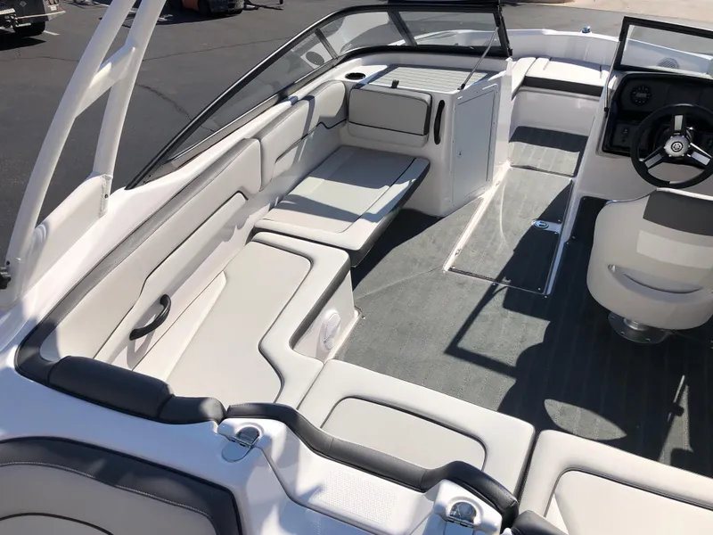 Slide: The Image of 2025 Yamaha Boats AR190 interior with sleek seating and modern dashboard design. - 17