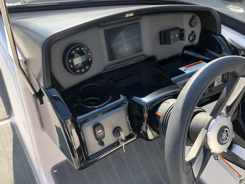 Slide: The Image of 2025 Yamaha Boats AR190 dashboard with steering wheel and control panel. - 31