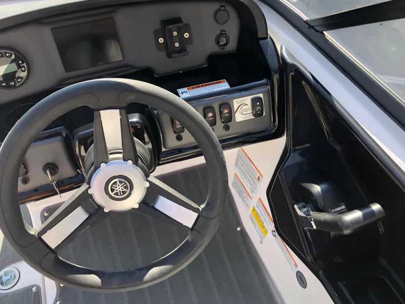 Slide: The Image of 2025 Yamaha Boats AR190 dashboard with steering wheel and control panel. - 33