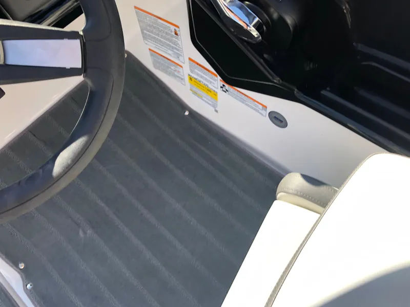 Slide: The Image of 2025 Yamaha Boats AR190 interior with steering wheel and seat detail. - 34