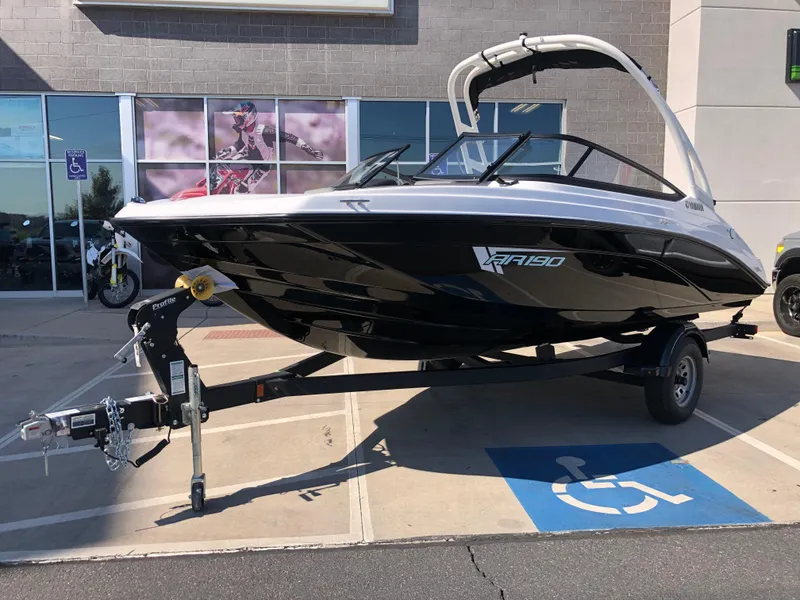 Slide: The Image of 2025 Yamaha Boats AR190 on trailer, parked in a lot. - 4