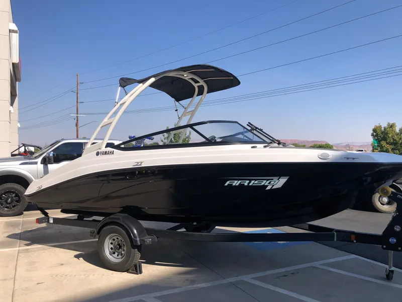 Slide: The Image of 2025 Yamaha Boats AR190 on trailer, sleek design, black and white color scheme. - 46