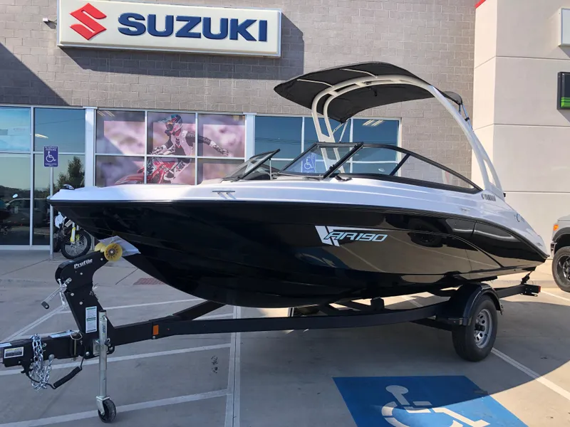 Slide: The Image of 2025 Yamaha AR190 boat displayed outside Suzuki dealership. - 47