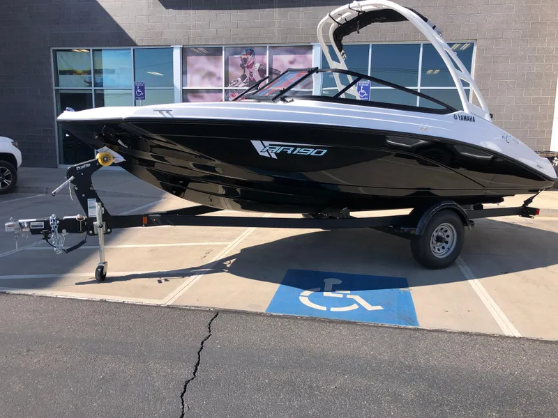 Slide: The Image of 2025 Yamaha Boats AR190 on trailer in parking lot. - 5