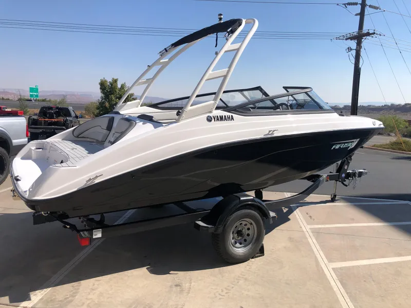 Slide: The Image of 2025 Yamaha Boats AR190 on trailer, sleek design, black and white color scheme. - 8