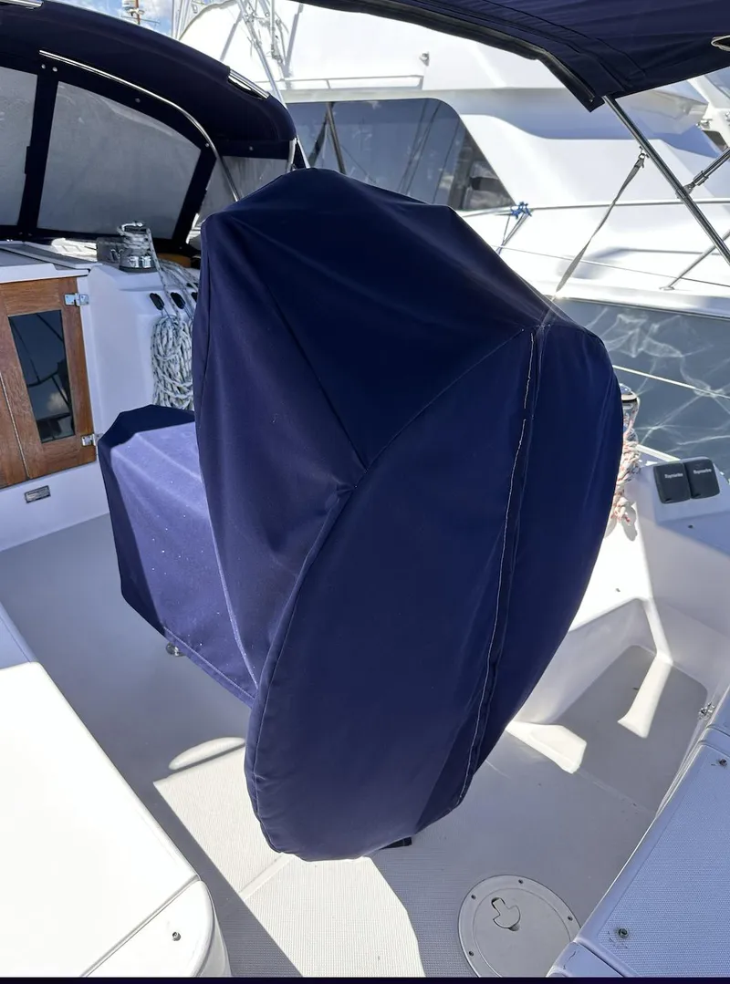 Slide: The Image of 2013 Catalina 355 yacht cockpit with covered steering wheel and seating area. - 10