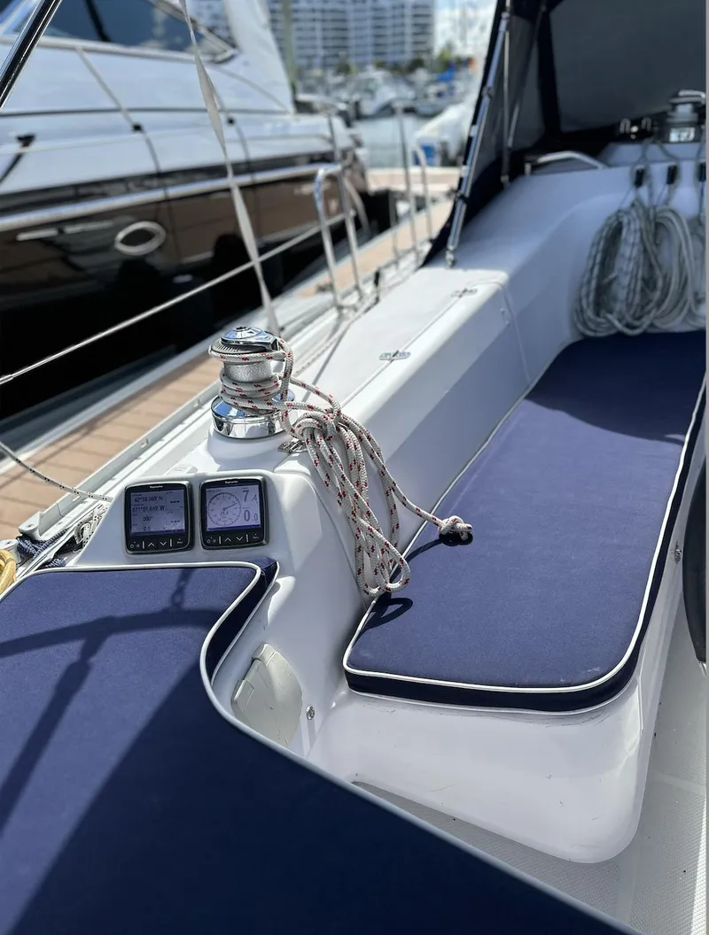 Slide: The Image of 2013 Catalina 355 sailboat cockpit with blue cushions and navigation instruments. - 14