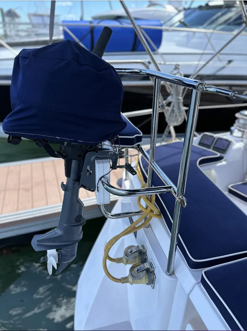 Slide: The Image of Catalina 355 sailboat, 2013 model, featuring a covered outboard motor and dockside view. - 15