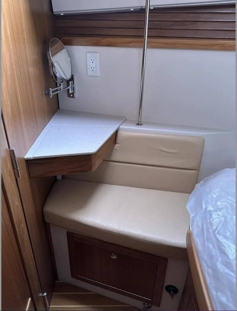 Slide: The Image of Interior of 2013 Catalina 355 sailboat with seating and small table. - 30