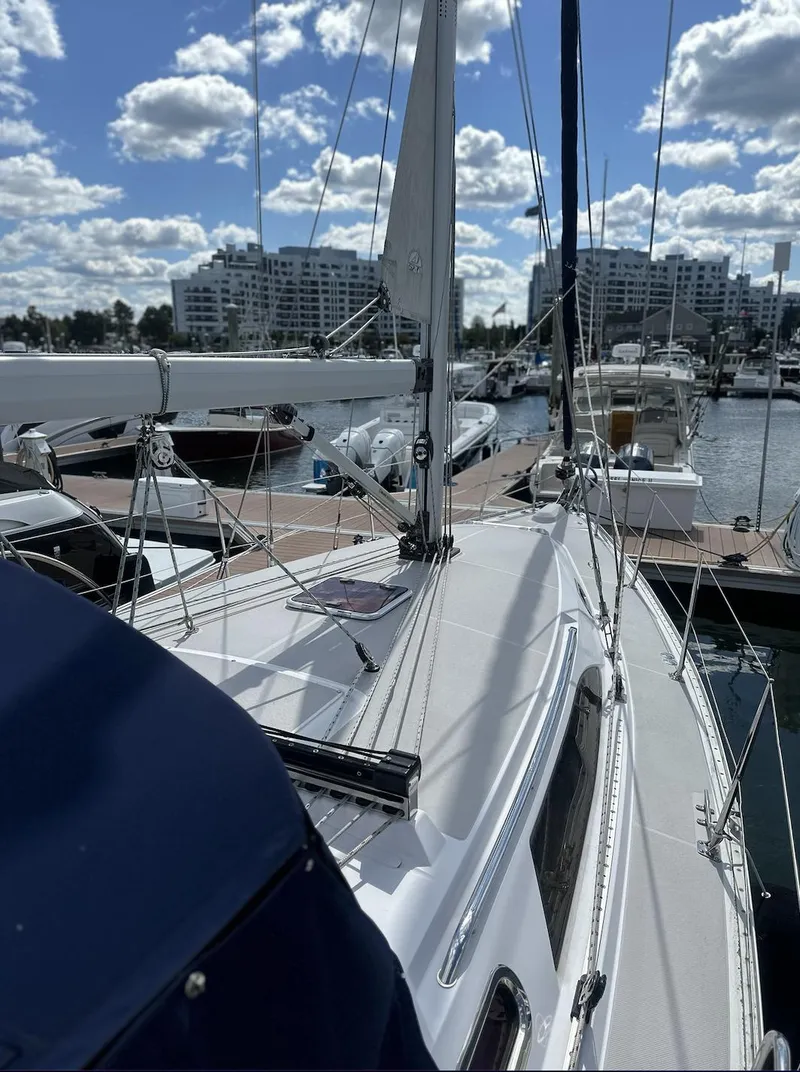 Slide: The Image of Sailboat Catalina 355, 2013 model, docked at marina under a partly cloudy sky. - 4