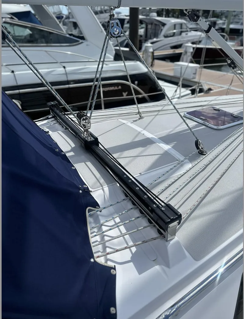 Slide: The Image of 2013 Catalina 355 sailboat deck with rigging and blue cover. - 5