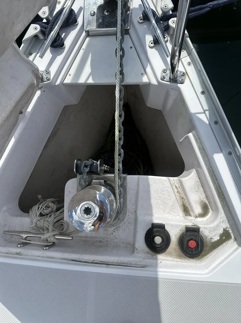 Slide: The Image of Anchor locker of a 2013 Catalina 355 sailboat with winch and rope. - 9