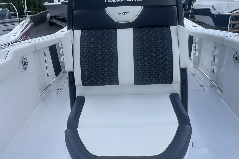 Slide: The Image of 2025 Tidewater 272 CC Adventure boat seat with black and white upholstery. - 14
