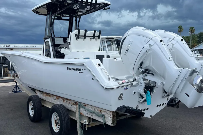 Slide: The Image of 2025 Tidewater 272 CC Adventure boat with dual engines on a trailer. - 4
