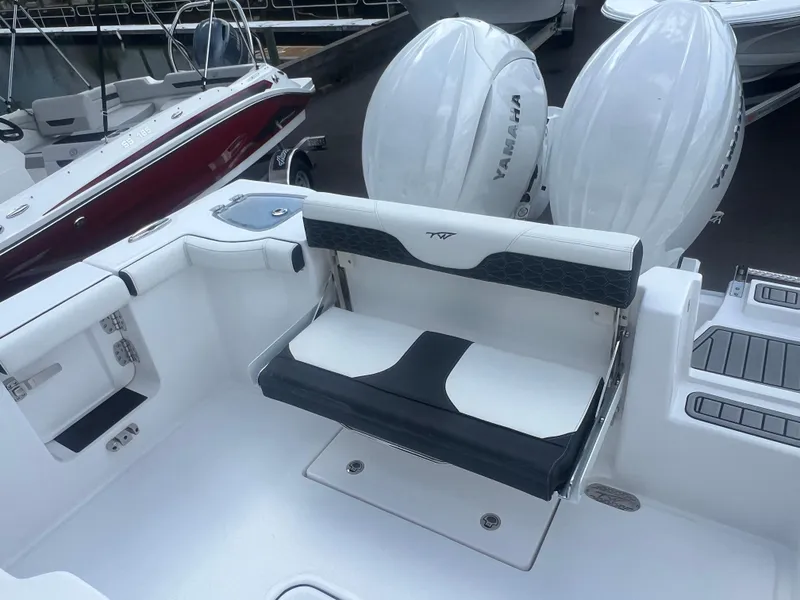 Slide: The Image of 2025 Tidewater 272 CC Adventure boat with Yamaha engines, featuring a sleek seating area. - 8