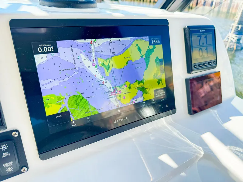 Slide: The Image of Garmin navigation display on 2024 MJM 3 boat dashboard. - 14