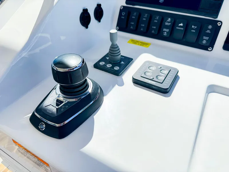 Slide: The Image of 2024 MJM 3 boat control panel with joystick and buttons. - 16