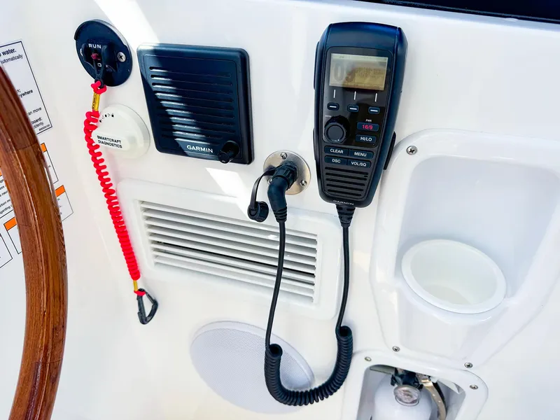 Slide: The Image of 2024 MJM 3 boat dashboard with radio, speaker, and controls. - 17