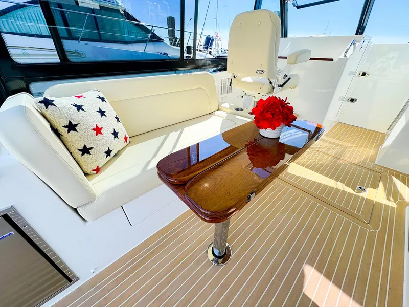 Slide: The Image of Luxurious 2024 MJM 3 yacht interior with elegant seating and wooden table. - 22