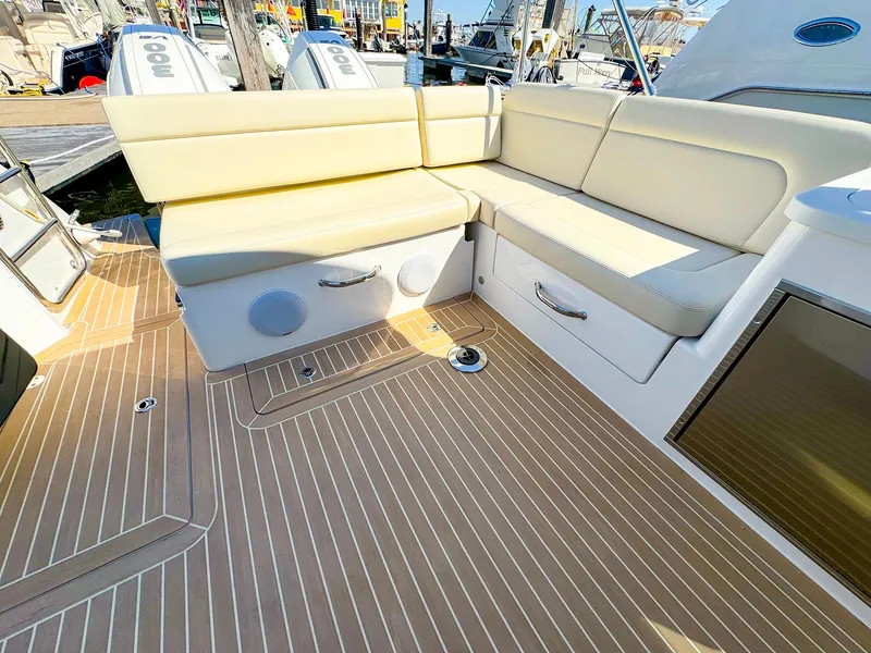 Slide: The Image of 2024 MJM 3 boat with beige seating and teak deck flooring. - 26