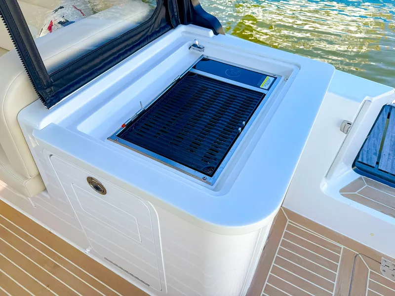 Slide: The Image of 2024 MJM 3 boat grill station with sleek design and water view. - 31