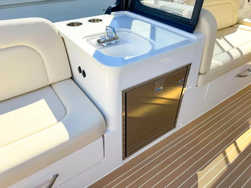 Slide: The Image of 2024 MJM 3 boat interior with sink, seating, and wood flooring. - 33