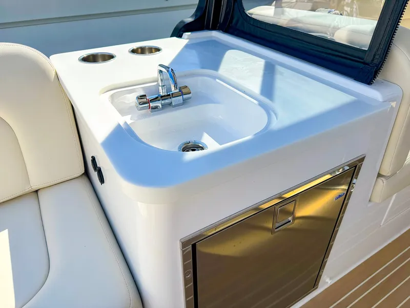 Slide: The Image of 2024 MJM 3 boat interior with sink and storage area. - 34