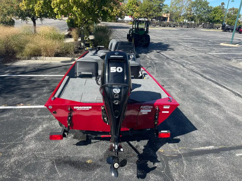 Slide: The Image of 2025 Tracker Bass Tracker Classic XL boat with Mercury 50 engine in a parking lot. - 5