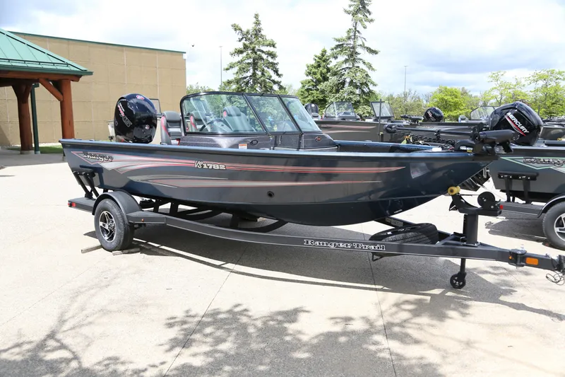 Slide: The Image of 2024 Ranger VS1782SC Angler boat on trailer, parked outdoors. - 1