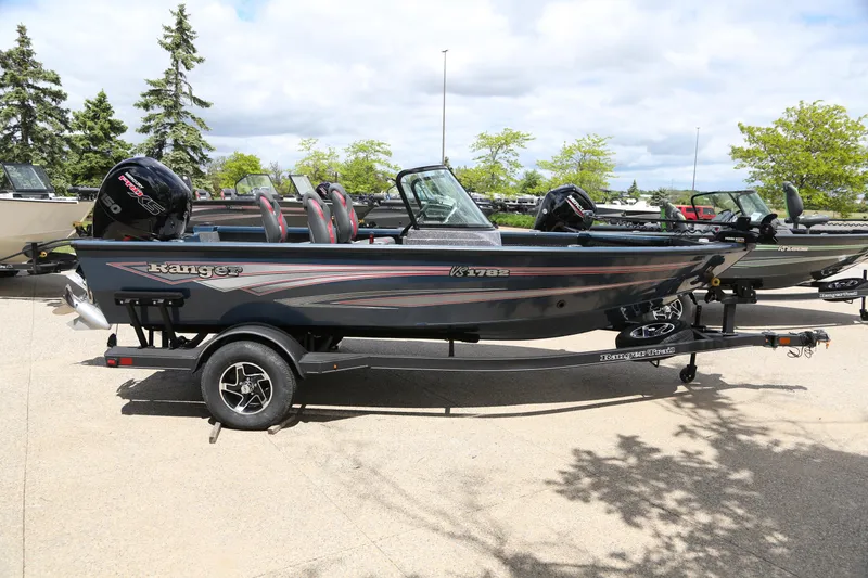 Slide: The Image of 2024 Ranger VS1782SC Angler boat on trailer, parked outdoors. - 2