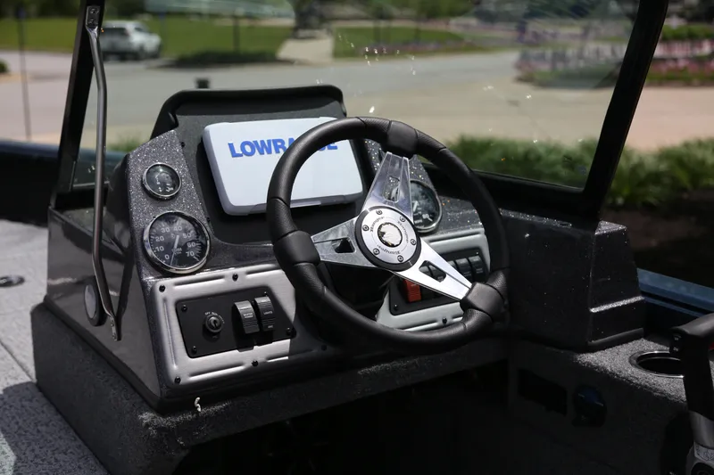 Slide: The Image of 2024 Ranger VS1782SC Angler boat dashboard with steering wheel and Lowrance display. - 5