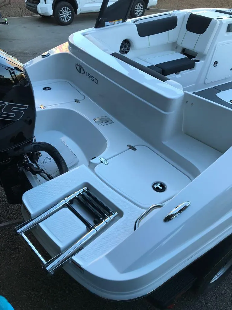 Slide: The Image of 2024 Tahoe 1950 boat with sleek design and modern features. - 12