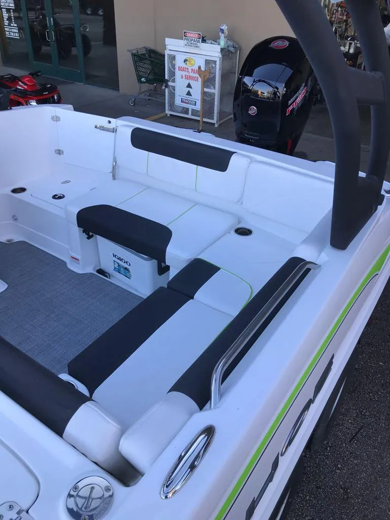 Slide: The Image of 2024 Tahoe 1950 boat interior with white and black seating, modern design. - 17